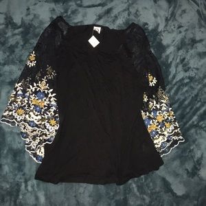 Black shirt with embroidered sleeves